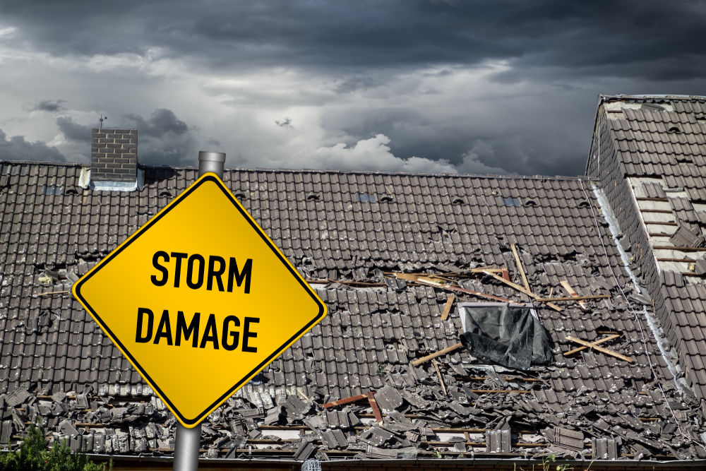 Yellow,Damage,Warning,Sign,In,Front,Of,Roof,Of,House