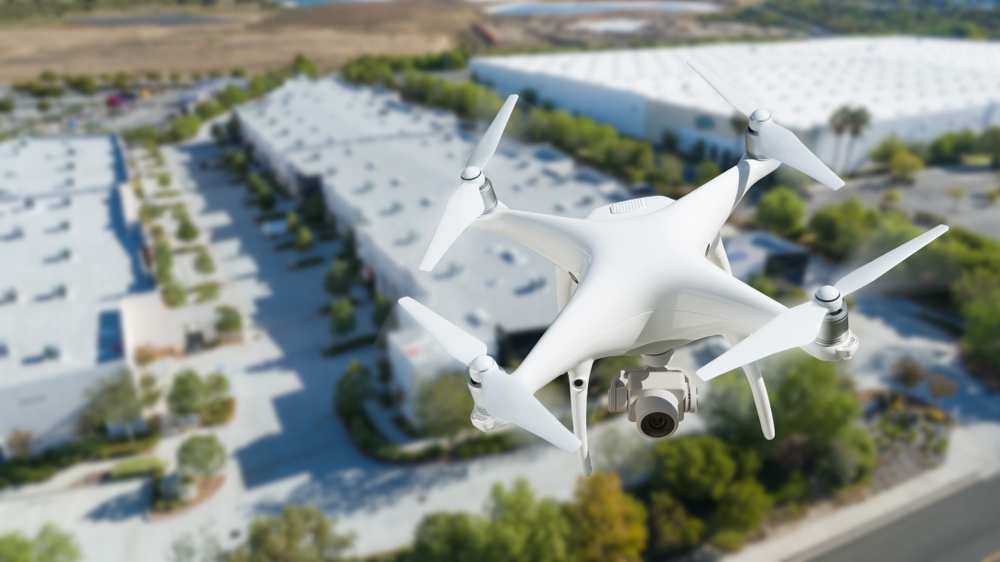 Unmanned,Aircraft,System,Quadcopter,Drone,In,The,Air,Near,Corporate